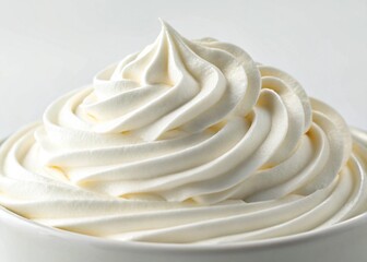 Whipped cream mound against a plain background
