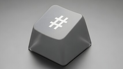 A solitary grey keyboard key featuring a white hash symbol or number sign graphic, isolated on a neutral background