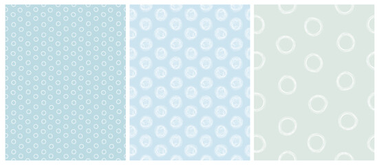 Seamless Irregular Vector Pattern With White Hand Drawn Dots And Circles Isolated on a Pastel Blue Background. Abstract Geometric Repeat Design Ideal For Fabric, Packaging. Childish Style Print. © Magdalena