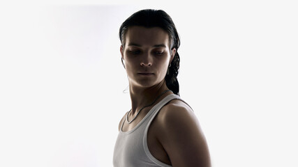 Man portrait looking down in studio on white background. Concept of skin recovery, cosmetic treatment results, dermatology services, wellness routines, and healthcare branding.