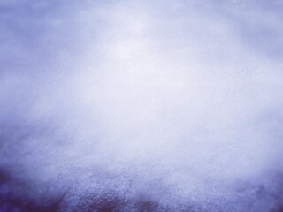Blurred snowy winter sky abstract background. Soft blue blurred texture of falling snow against cloudy sky, minimal dreamy winter atmosphere for overlays.