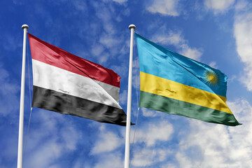 Waving flags of the Yemen and Rwanda together on blue sky background. Official diplomatic relations, partnership and business concept.