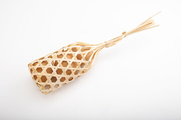 Fresh chicken eggs in bamboo container on white background