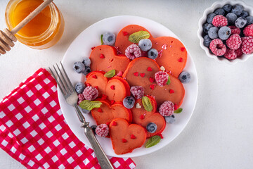 Red velvet pancakes in form of hearts for Valentine Day