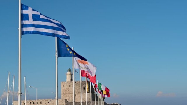 Flags of Greece and Europe at Mandraki Harbour