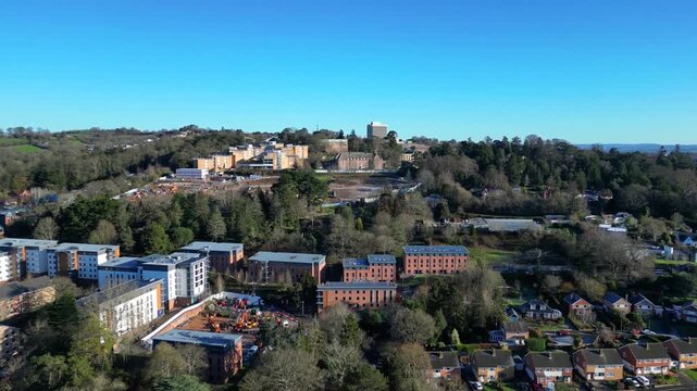 Exeter, Devon, England: DRONE VIEWS: The drone flies towards Exeter University as diggers work on a construction project in the University grounds. Exeter is a cathedral city and pre-dates Roman times