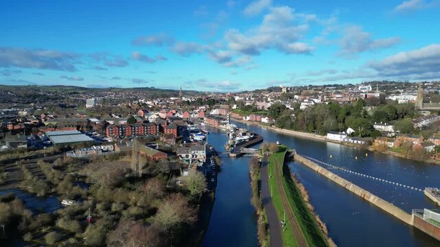 Exeter, South Devon, England: DRONE VIEWS: The drone ascends over Exeter Ship Canal (left) and the River Exe (right) junction showing: Exeter Quays; Exeter Cathedral. Exeter pre-dates Roman times.