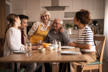 Multi-generational family enjoying a happy lunch gathering