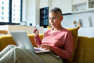 Senior woman shopping online at home