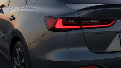 Close-up of a modern cars sleek LED taillight design at dusk, showcasing automotive elegance.
