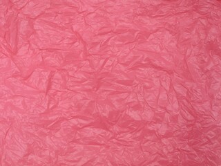 Abstract crumpled pink plastic bag texture. Suitable for background. Copy space