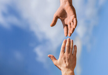 Closeup help hand. Two hands, helping arm friend, teamwork. Helping hand outstretched, salvation
