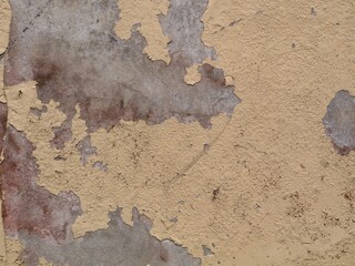 Weathered peeling paint on concrete wall texture. ideal for vintage backgrounds, urban design projects, or 3D texturing overlays	