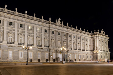 Obraz premium The Royal Palace of Madrid, Spain, (Palacio Real de Madrid) on Plaza de la Armeria, night view, illuminated facade.