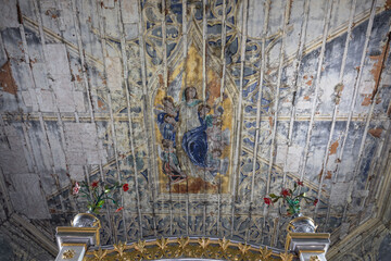 Fototapeta premium Decayed religious ceiling fresco with Madonna and angels