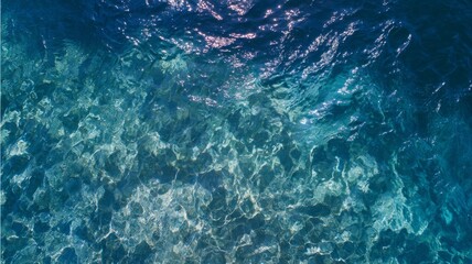 Crystal-clear turquoise ocean water viewed from above. Sunlight dances on surface, creating intricate patterns. Calming, serene seascape. Neural network AI generated