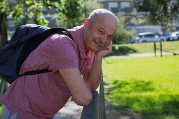 Senior pensioner relaxing outdoors, enjoying a walk and fresh air during retirement.