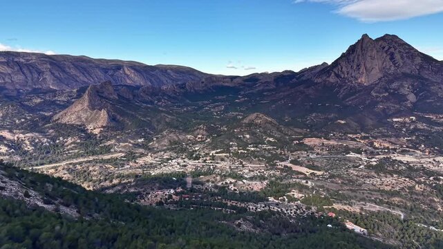 aerial mapping view of valley with dominant peak and clustered settlements cartographer perspective