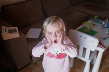 Surprised child looking with amazement, Wow emotion and unexpected news concept.