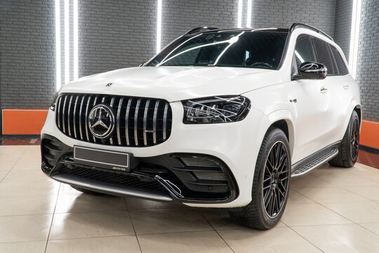 White matte Mercedes-Benz GLS 63 4MATIC+ AMG V8 Biturbo in the showroom. Exterior of a white SUV. Mercedes-Benz GLS 63 AMG X167 in the showroom Germany premium SUV car. Wrapping car matte PPF. 