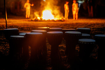 Drums Arranged Near Bonfire at Night