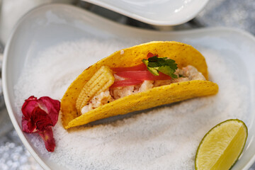 Seafood Taco with Baby Corn and Lime Wedge