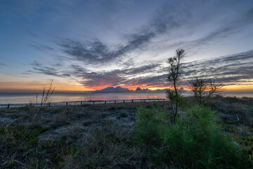 sunrise romantic couple on Corsican coast near Bastia Etang de Biguglia Camping San Daminao Beachside Corse
