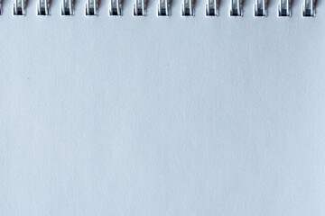 Close-up of white leather texture showing natural grain and refined decorative background.