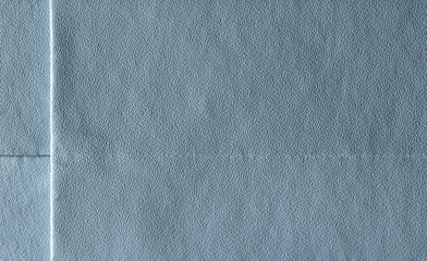 Minimal blue cardboard texture with visible paper grain and fold, perfect for branding and layout design.