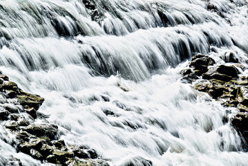 Water cascading over the rocks with a silky effect