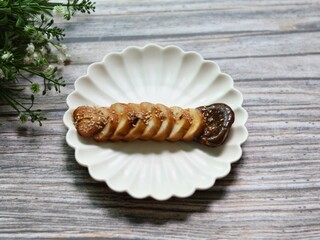 Korean Soy Braised King Oyster Mushroom Served on a White Plate