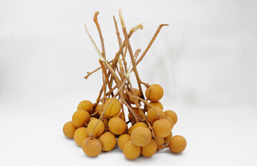 Fresh longan fruit on the white background. close up details of longan fruit or kelengkeng fruit.