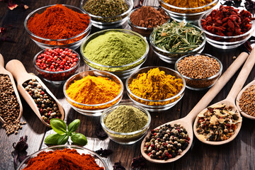 Fototapeta premium Variety of spices and herbs on kitchen table