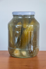 Homemade pickled cucumber in glass jar.