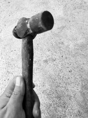 An old iron hammer with a wooden handle. This hammer is for those of you who like home repairs, making tables or the like. 