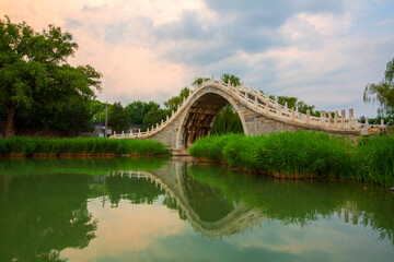 Xiuyi Bridge sunset glow reflection landscape on Kunming Lake, Summer Palace, Beijing, China