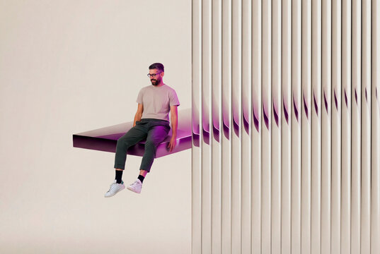 Man sitting on geometric 3D edge scene
