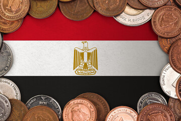 Coins on flag of Egypt trading investment business currency concept

