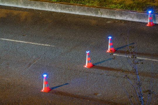 Police road cones marking nighttime traffic checkpoint