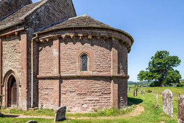 The semi circular apse on the eastern end of the Norman Romanesque church of St Mary and St David (built 1140 AD) at Kilpeck, Herefordshire, England UK