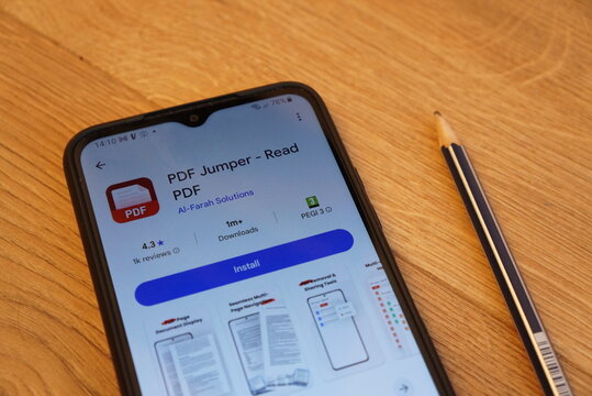 Smartphone screen displaying PDF Jumper app with install button and pencil nearby