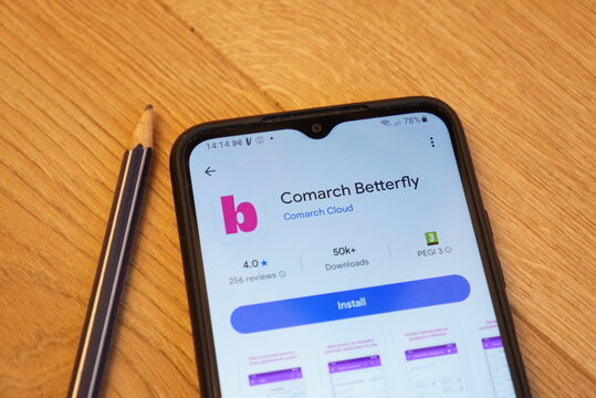 Comarch Betterfly app displayed on a smartphone screen next to a pencil