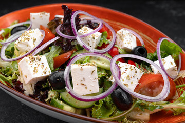 Greek salad on dark background
