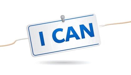A sign with the words "I CAN" is attached to a white background. It's held in place with a metal pin and string