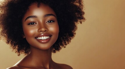 Beauty portrait of african american girl with clean healthy skin on beige background. Smiling dreamy beautiful black woman.Curly hair in afro style