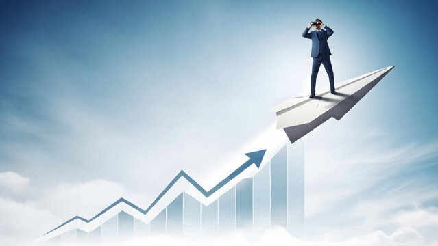 Businessman in blue suit stands on rising arrow graph looking ahead