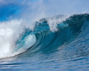 Powerful wave breaking in the sea. Close up view from water