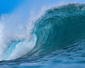 Powerful wave breaking in the sea. Close up view from water
