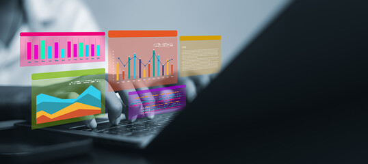 Close up of businessman hands typing on laptop keyboard with colorful financial charts and graphs overlay, representing data analysis, business growth and digital marketing strategy in office.