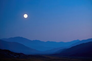 Full moon rising over layered blue mountains at twilight. Concept Full Moon Rising, Layered Blue Mountains, Twilight Landscape, Moonlit Night Sky, Mountain Silhouettes